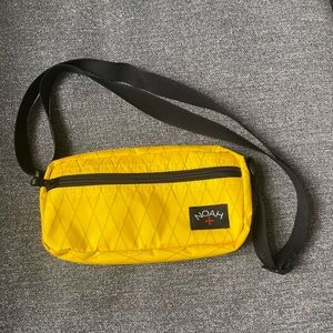 Noah cross body bag in Yellow
